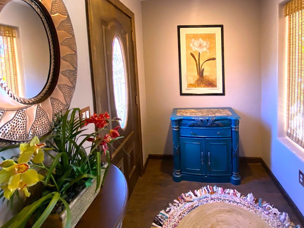 A blue cabinet in the corner of a room.